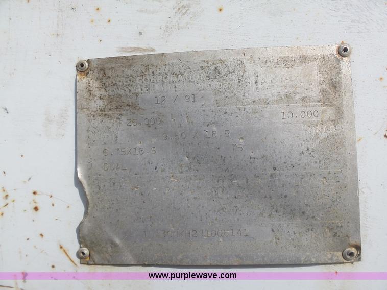 image for item BH9371 1992 Nissan truck and Landoll trailer