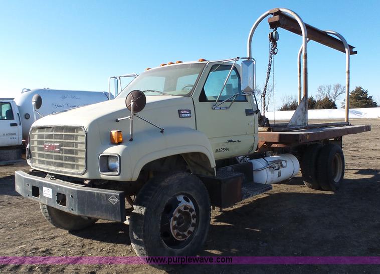 image for item L6256 1999 GMC C7500 flatbed truck