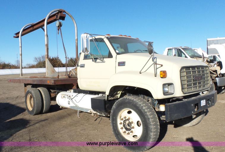 image for item L6256 1999 GMC C7500 flatbed truck