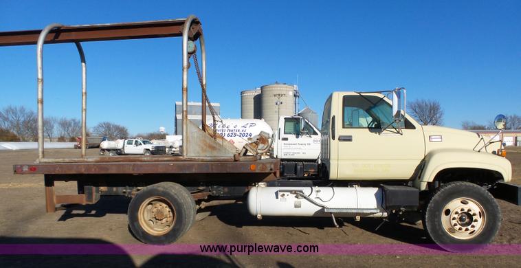 image for item L6256 1999 GMC C7500 flatbed truck