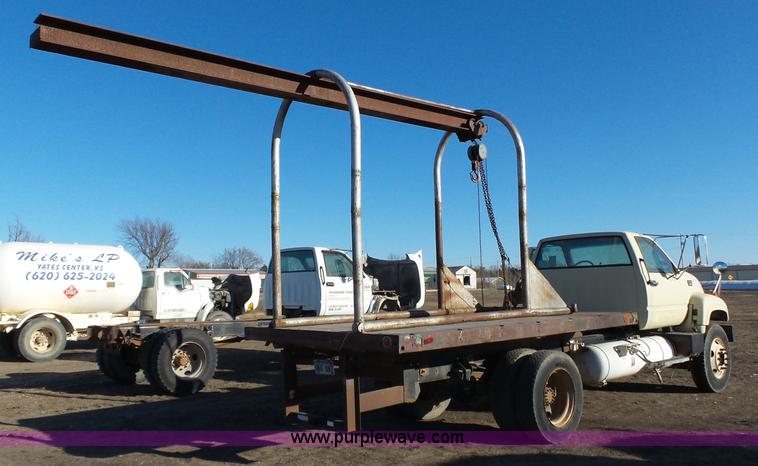 image for item L6256 1999 GMC C7500 flatbed truck