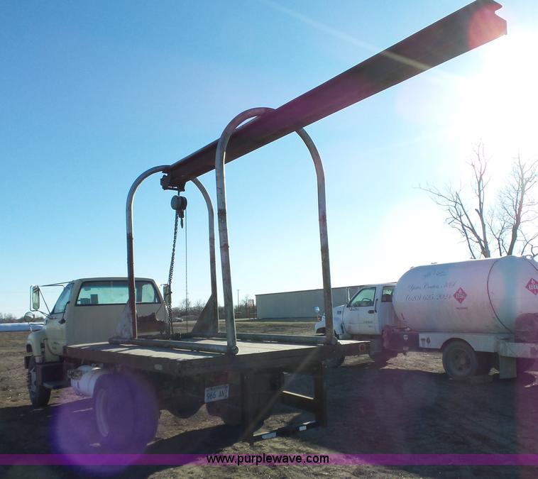 image for item L6256 1999 GMC C7500 flatbed truck