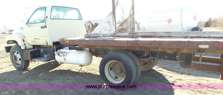 image for item L6256 1999 GMC C7500 flatbed truck