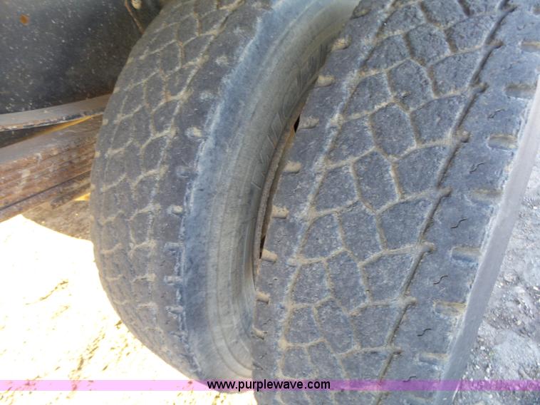 image for item L6256 1999 GMC C7500 flatbed truck