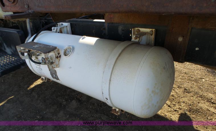 image for item L6256 1999 GMC C7500 flatbed truck