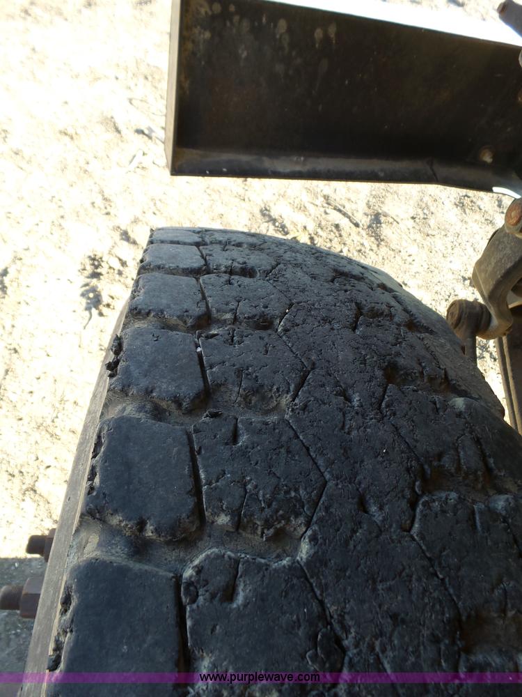 image for item L6256 1999 GMC C7500 flatbed truck