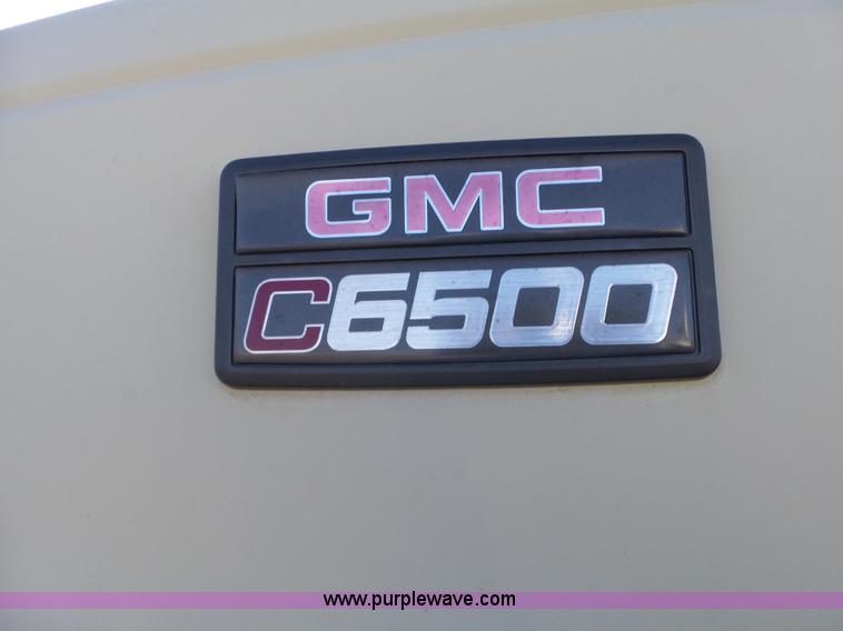image for item L6256 1999 GMC C7500 flatbed truck