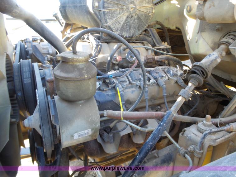 image for item L6256 1999 GMC C7500 flatbed truck