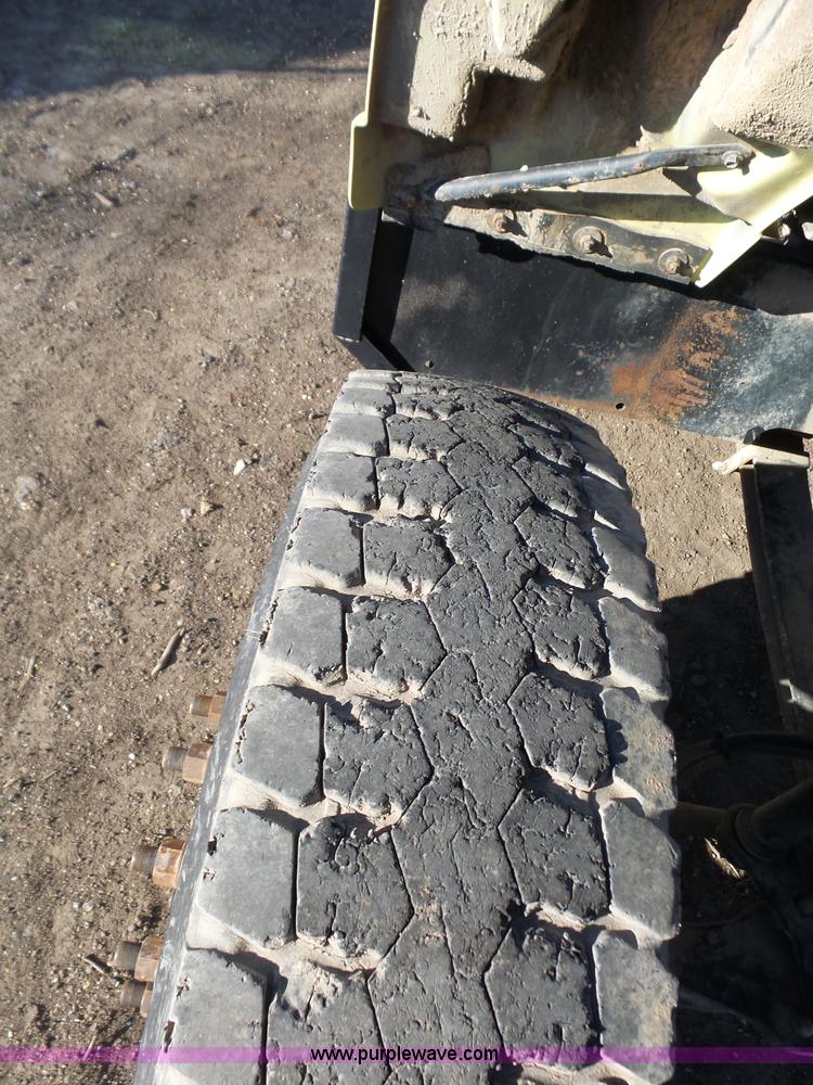 image for item L6256 1999 GMC C7500 flatbed truck