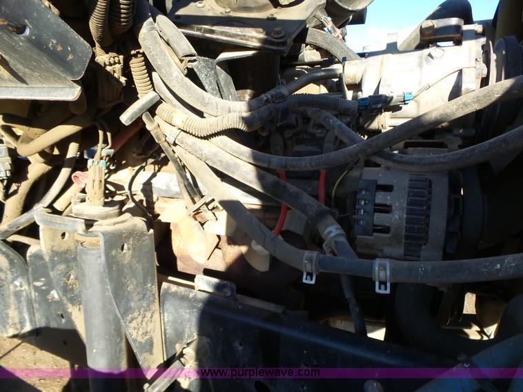 image for item L6256 1999 GMC C7500 flatbed truck