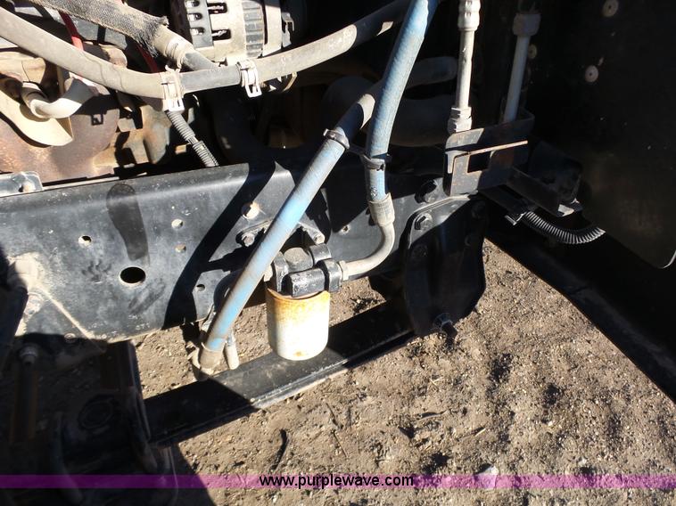 image for item L6256 1999 GMC C7500 flatbed truck