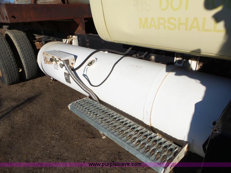 image for item L6256 1999 GMC C7500 flatbed truck