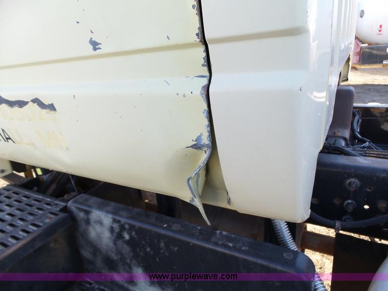 image for item L6256 1999 GMC C7500 flatbed truck