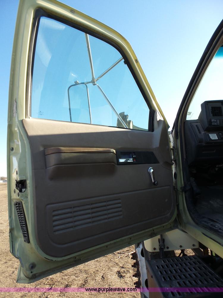 image for item L6256 1999 GMC C7500 flatbed truck