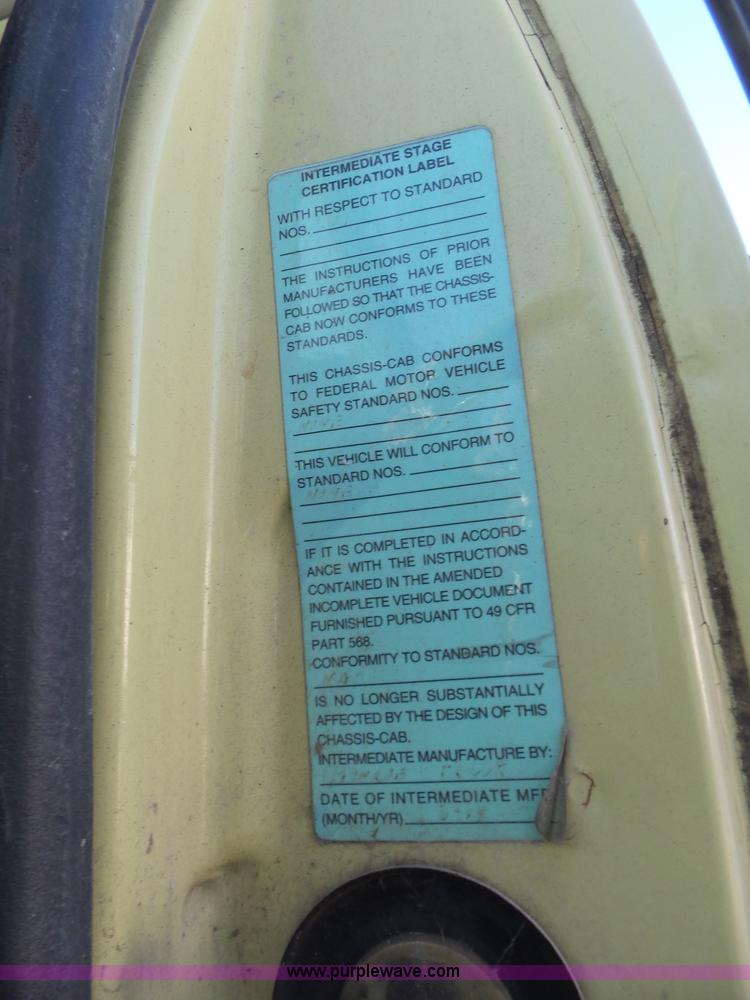 image for item L6256 1999 GMC C7500 flatbed truck