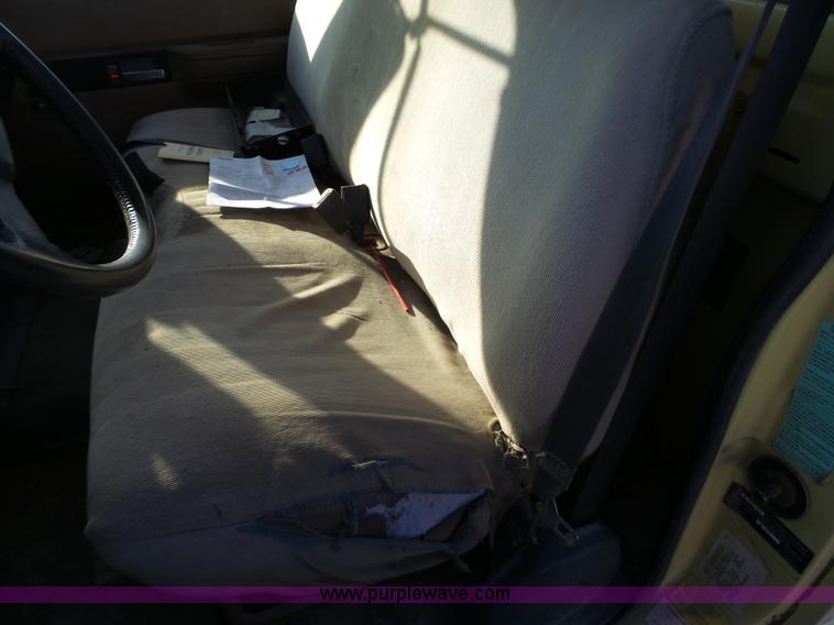 image for item L6256 1999 GMC C7500 flatbed truck