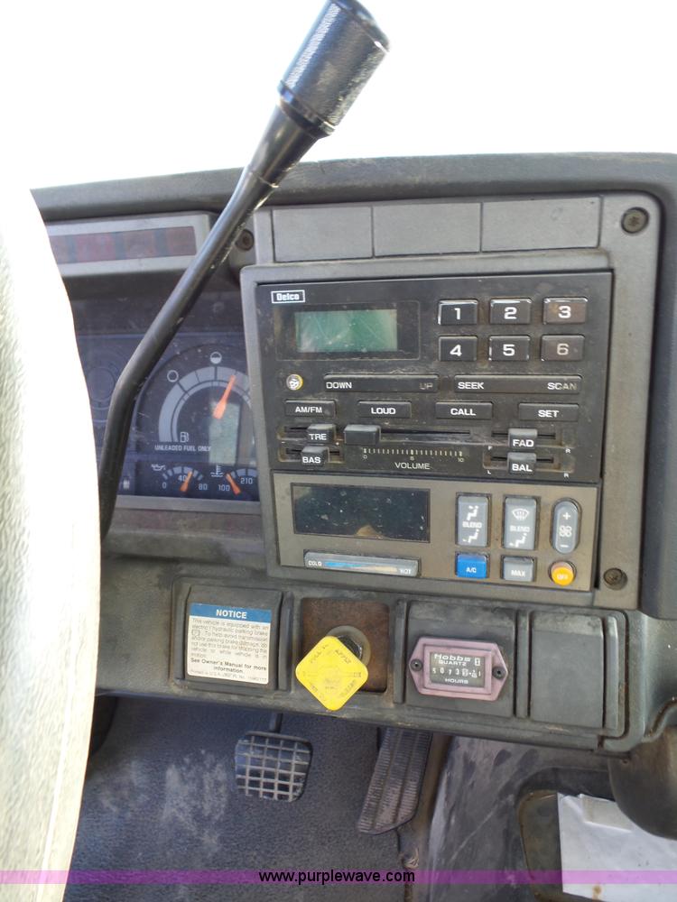 image for item L6256 1999 GMC C7500 flatbed truck