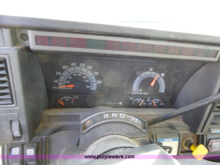 image for item L6256 1999 GMC C7500 flatbed truck