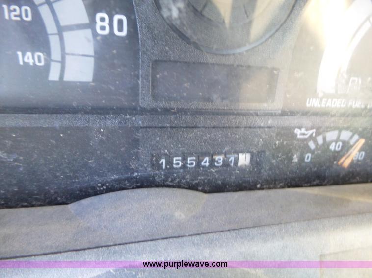 image for item L6256 1999 GMC C7500 flatbed truck