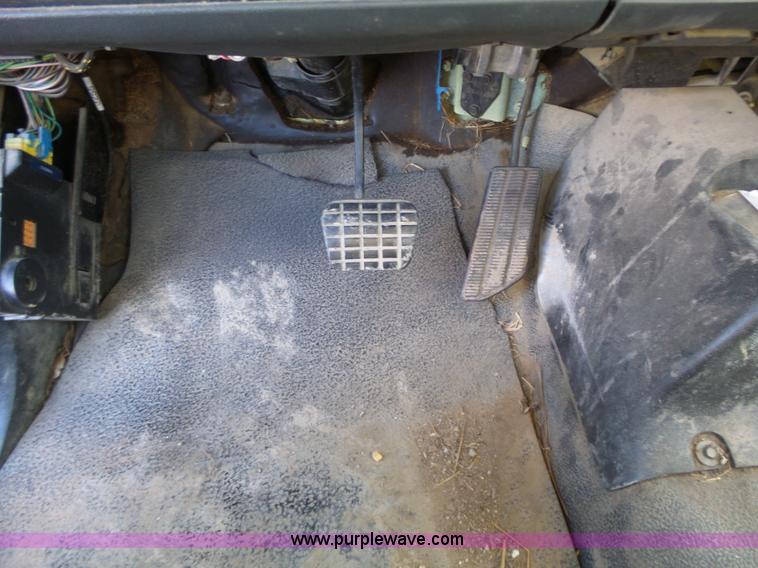 image for item L6256 1999 GMC C7500 flatbed truck