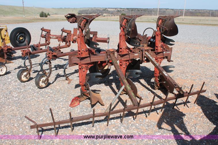 image for item L6865 International Harvester three bottom rollover plow