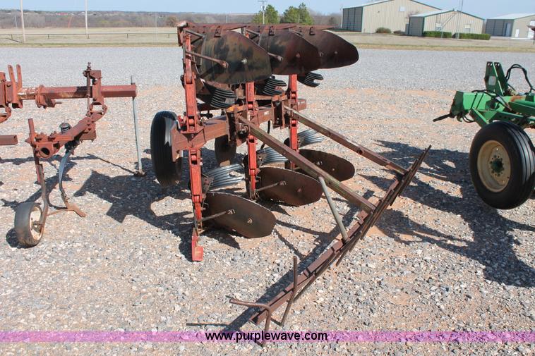 image for item L6865 International Harvester three bottom rollover plow