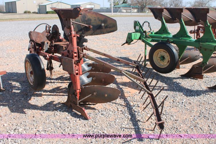 image for item L6865 International Harvester three bottom rollover plow