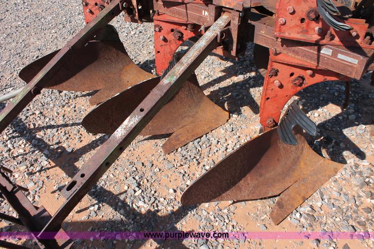 image for item L6865 International Harvester three bottom rollover plow