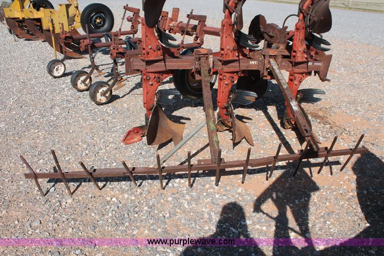 image for item L6865 International Harvester three bottom rollover plow