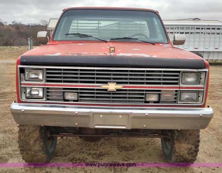 image for item L7318 1984 Chevrolet Silverado C10 flatbed pickup truck