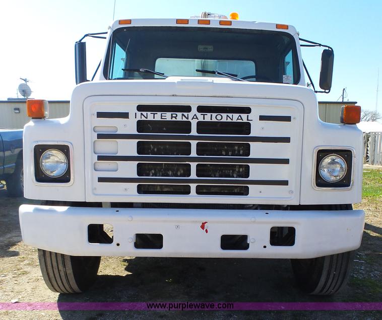 image for item L5613 1985 International S1954 flatbed truck with crane