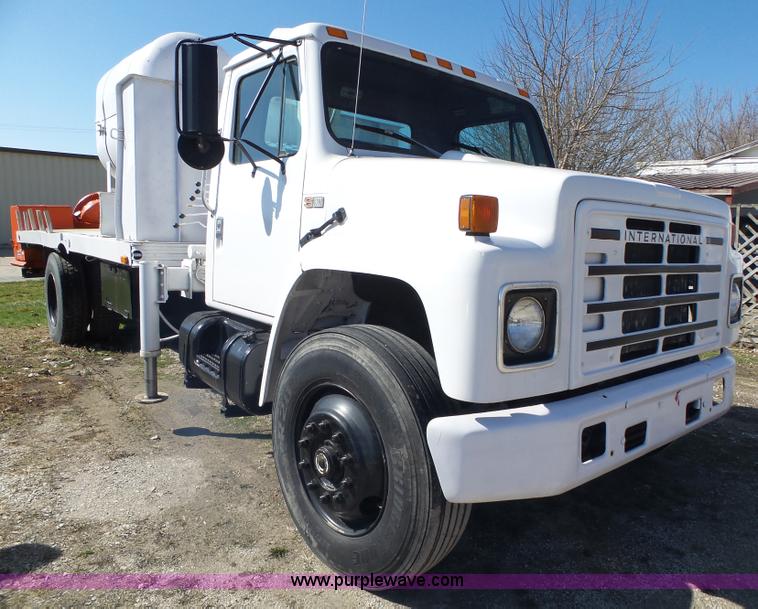 image for item L5613 1985 International S1954 flatbed truck with crane