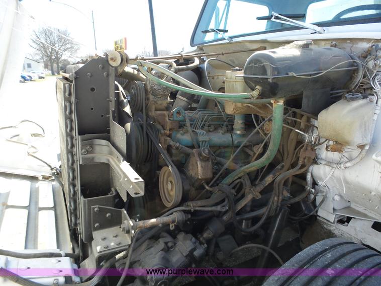 image for item L5613 1985 International S1954 flatbed truck with crane