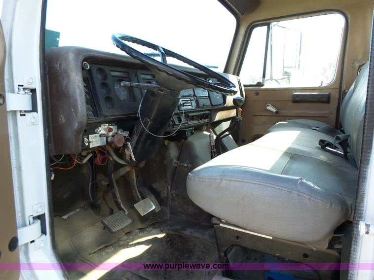 image for item L5613 1985 International S1954 flatbed truck with crane