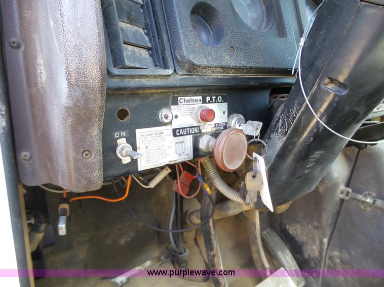 image for item L5613 1985 International S1954 flatbed truck with crane