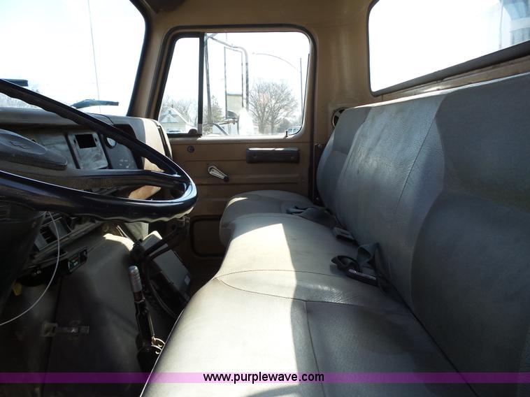 image for item L5613 1985 International S1954 flatbed truck with crane