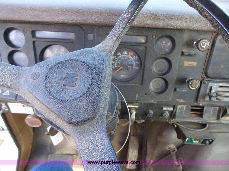 image for item L5613 1985 International S1954 flatbed truck with crane