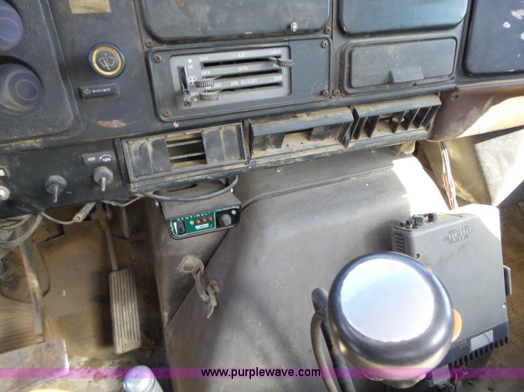 image for item L5613 1985 International S1954 flatbed truck with crane