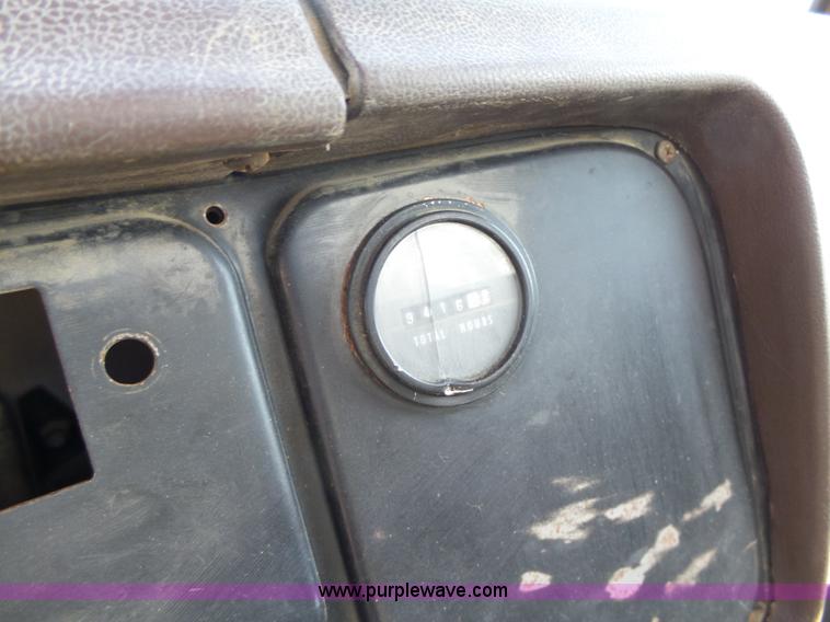 image for item L5613 1985 International S1954 flatbed truck with crane