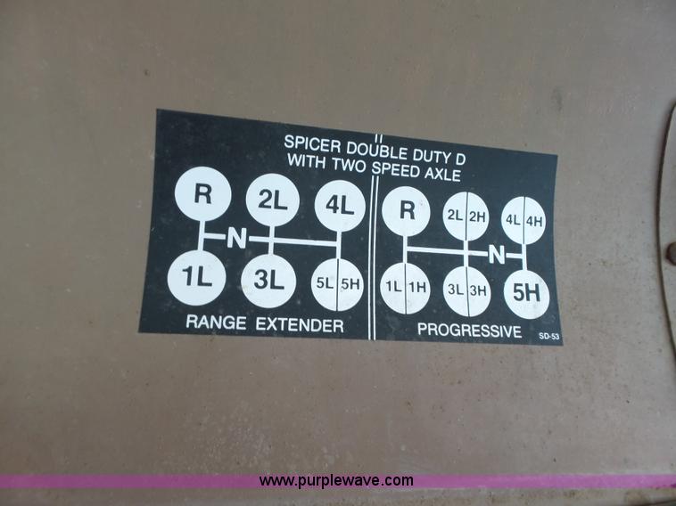 image for item L5613 1985 International S1954 flatbed truck with crane