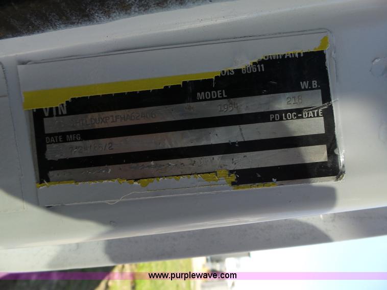 image for item L5613 1985 International S1954 flatbed truck with crane