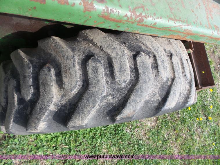 image for item J4174 John Deere 70 skid steer