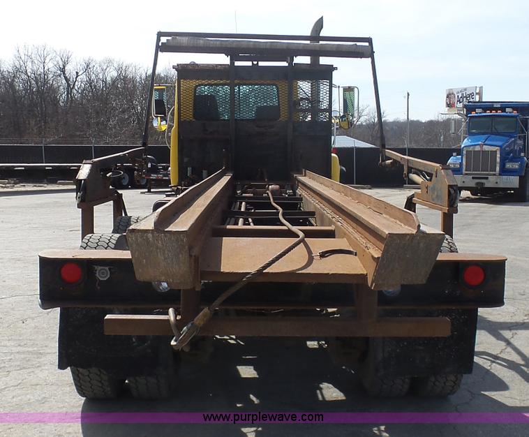 image for item L3209 1988 Mack DM690S roll off truck