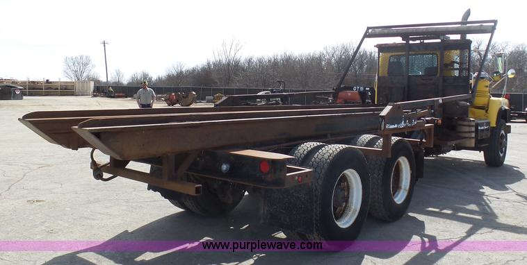 image for item L3209 1988 Mack DM690S roll off truck