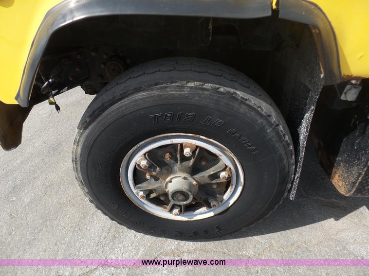 image for item L3209 1988 Mack DM690S roll off truck