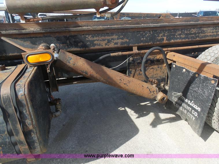 image for item L3209 1988 Mack DM690S roll off truck