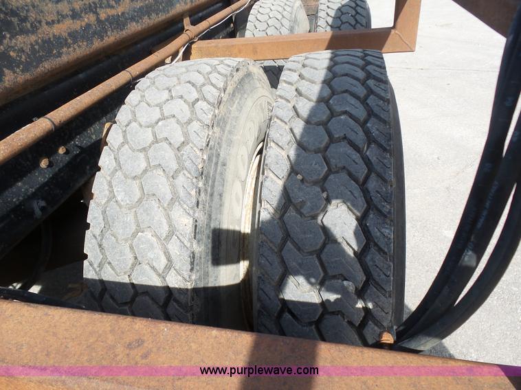 image for item L3209 1988 Mack DM690S roll off truck