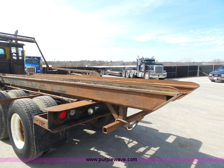 image for item L3209 1988 Mack DM690S roll off truck