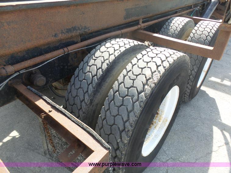 image for item L3209 1988 Mack DM690S roll off truck