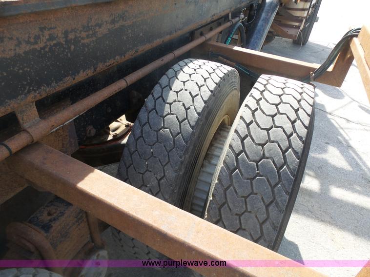 image for item L3209 1988 Mack DM690S roll off truck